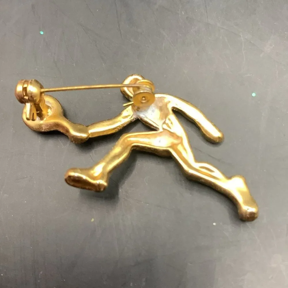 Gold tennis player pin brooch